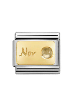 Nomination charm link with "Nov" inscription and citrine stone detail; classic composable bracelet component.