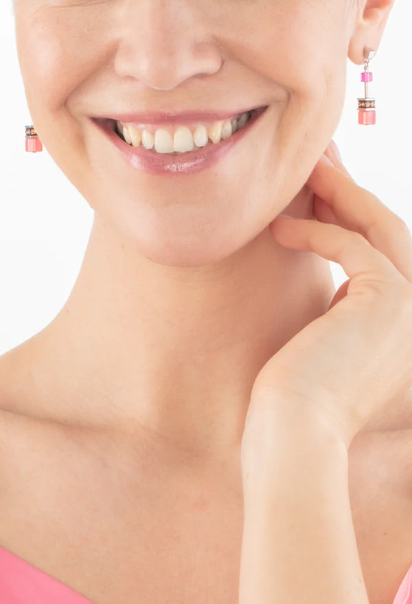 The Coeur De Lion GeoCube Viva Magenta Earrings, a magenta stainless steel earrings from Coeur De Lion, available at OD’s Jewellers in St Helens.