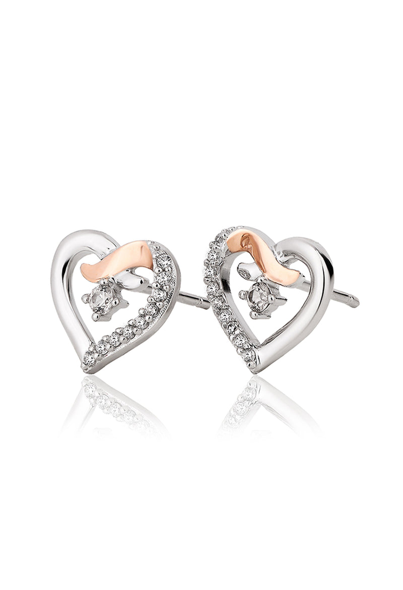 Sterling silver Clogau kiss stud earrings featuring CZ accents. Jewelry detail promoting Forever Yours collection.
