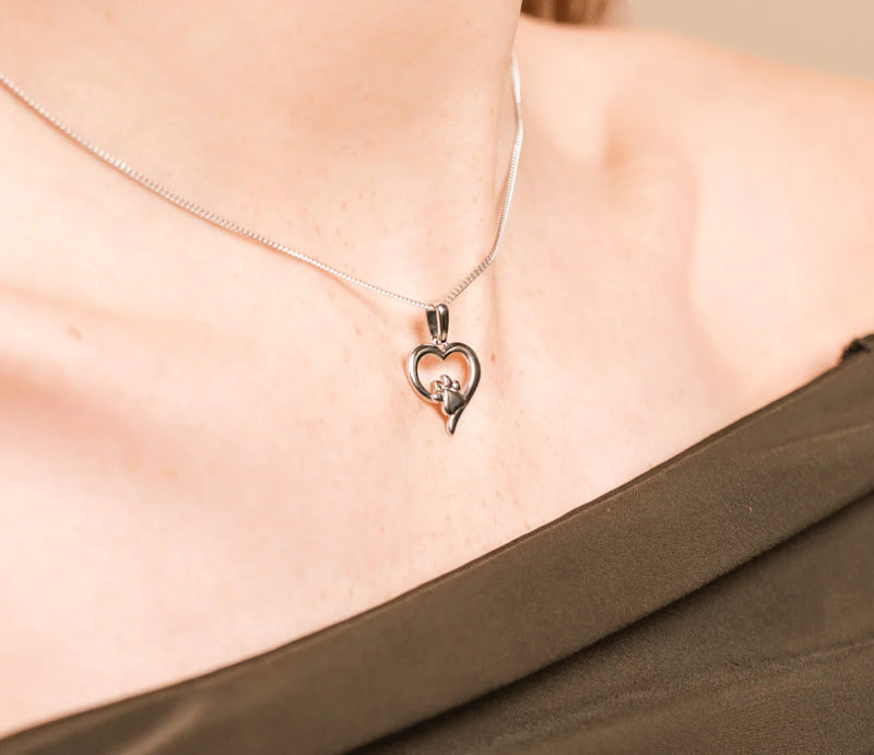 The Clogau Paw Print and Heart Pendant, a silver sterling pendant from Clogau, available at OD’s Jewellers in St Helens