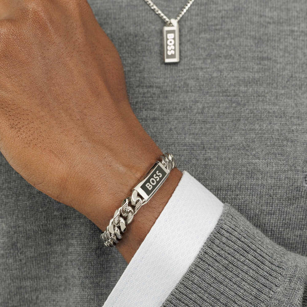 Close-up of BOSS bracelet on wrist, showcasing the polished stainless steel and Kassy emblem. Features BOSS branding on