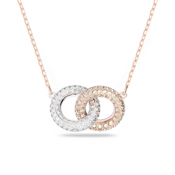 Swarovski necklace featuring rose gold & crystal pave interlocking circles. Elegant jewelry piece on display.