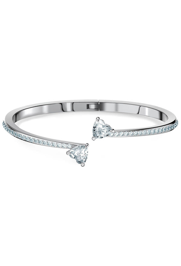 The Swarovski Attract Soul Heart Bangle, a silver metal bracelet from Swarovski, available at OD’s Jewellers in St Helens.