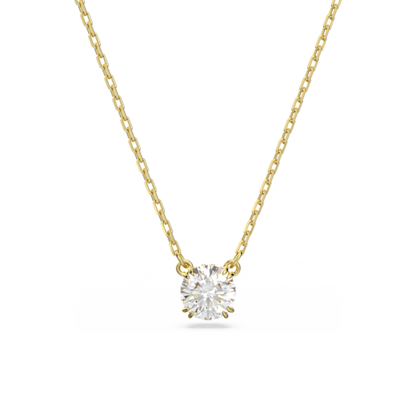 Constella pendant necklace: gold plated chain showcasing a brilliant round cut Swarovski crystal. Elegant jewelry.