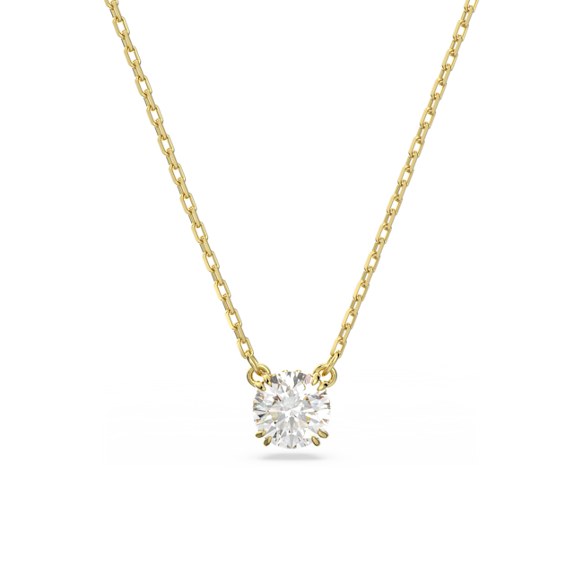 Constella pendant necklace: gold plated chain showcasing a brilliant round cut Swarovski crystal. Elegant jewelry.