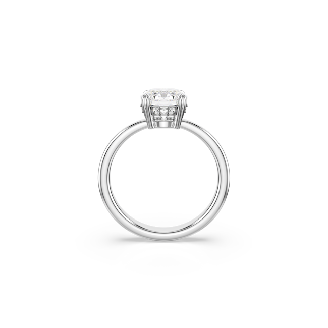 Rhodium plated cocktail ring featuring a round cut Swarovski crystal. Elegant jewelry close up view.