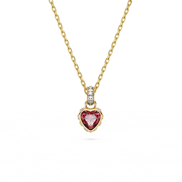 Gold-plated Swarovski crystal heart pendant necklace, Stilla Collection. Showcases a red heart stone and sparkling design.