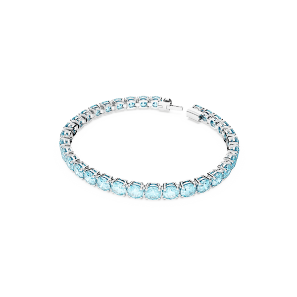 Swarovski Matrix Tennis Bracelet in blue. Rhodium plated, size M. Elegant jewelry perfect for adding sparkle to any outfit.