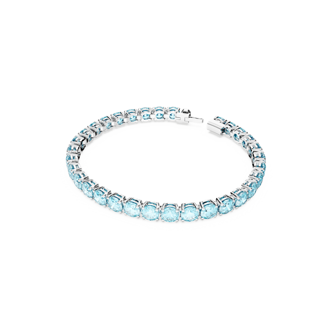 Swarovski Matrix Tennis Bracelet in blue. Rhodium plated, size M. Elegant jewelry perfect for adding sparkle to any outfit.