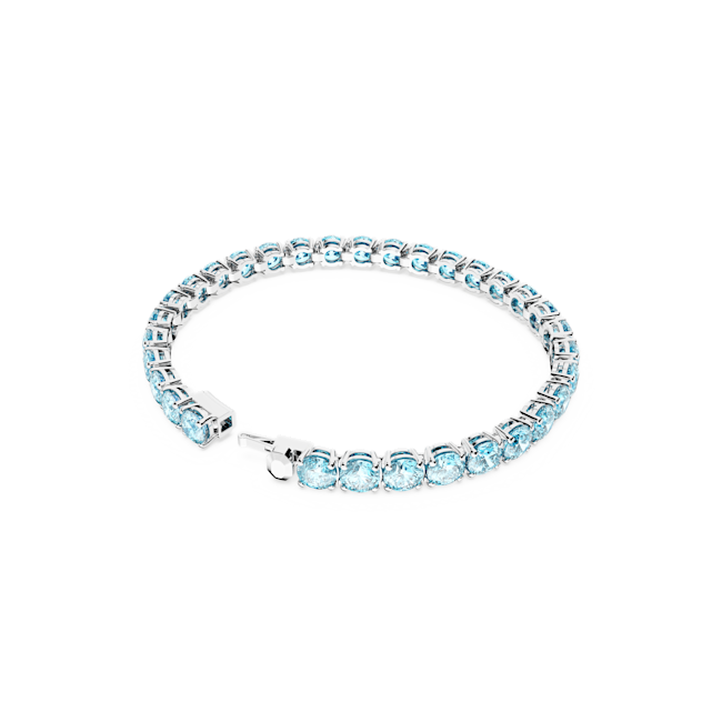 Swarovski tennis bracelet featuring blue crystals and rhodium plating, showcasing the Matrix collection design.