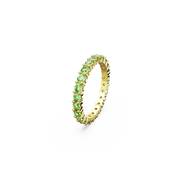 Close-up of the Swarovski Matrix ring featuring round cut green stones with gold plated finish, showcasing its design.