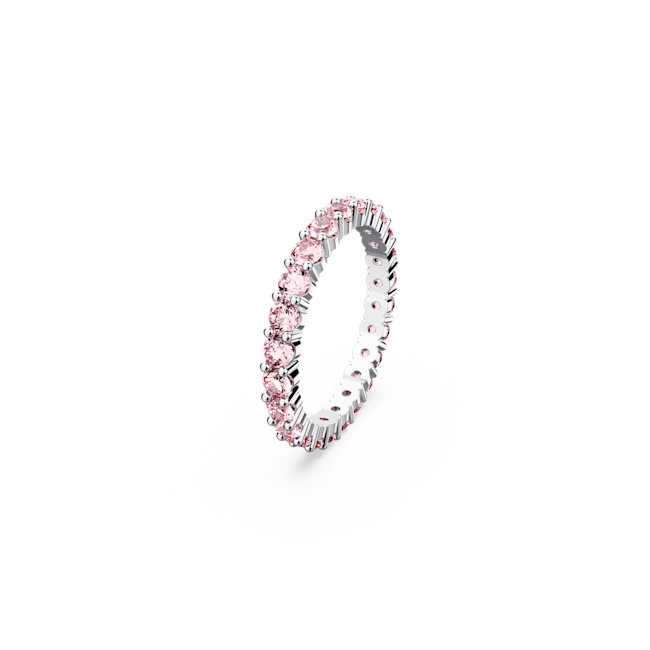 Rhodium-plated Swarovski ring featuring an eternity band design with pink crystal stones set all around the band.