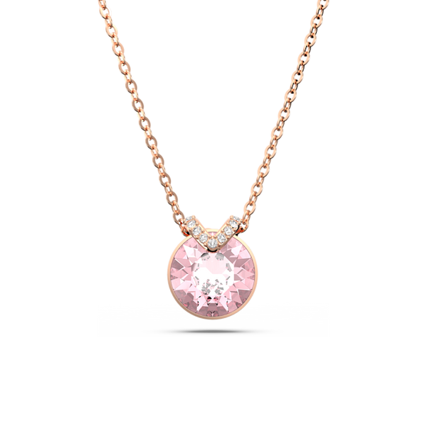 Rose gold pendant necklace featuring a sparkling pink crystal. A timeless Swarovski jewelry gift.