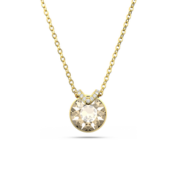 Close-up of a gold-plated Swarovski Bella V pendant necklace featuring a brilliant round crystal stone.