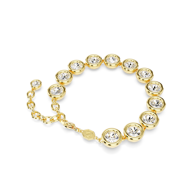 Close-up of the gold-plated Swarovski Imber tennis bracelet featuring round-cut crystal bezels, showcasing its design.