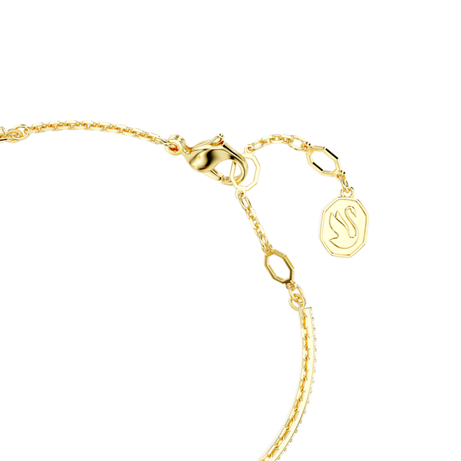 Close-up of a gold-plated Swarovski bangle clasp featuring the brand's iconic swan logo charm.