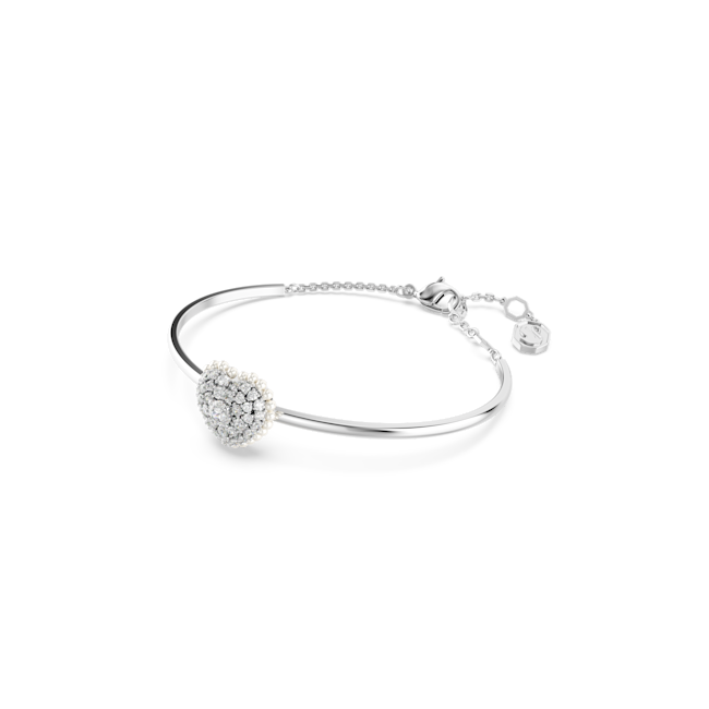 Swarovski crystal bangle showcasing heart charm detail. Elegant rhodium plated bracelet jewelry.