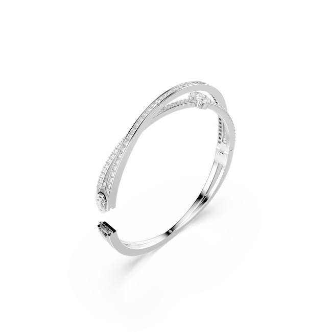Swarovski Hyperbola bangle featuring mixed-cut crystals on a rhodium-plated setting. Elegant designer jewelry.