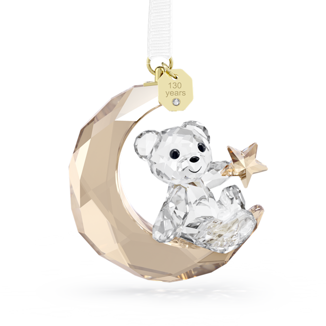 Swarovski Kris Bear 2025 ornament. Crystal bear on moon with star, "130 years" tag. Collectible Christmas decor.