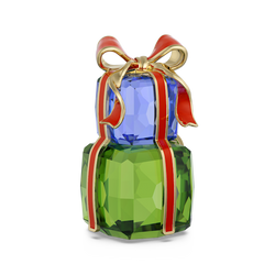 Swarovski crystal ornaments set. Festive gift display with blue and green crystal presents and a red ribbon. Holiday décor.