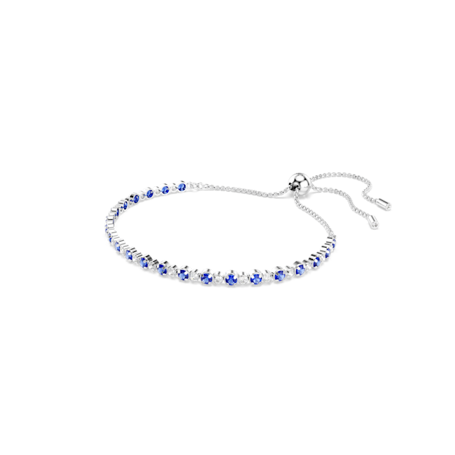 Swarovski Matrix tennis bracelet. Delicate rhodium-plated design with alternating blue & white crystals. Adjustable closure.