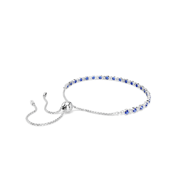 Swarovski Matrix Tennis Bracelet featuring blue and white crystals with a rhodium-plated finish. Adjustable bolo closure