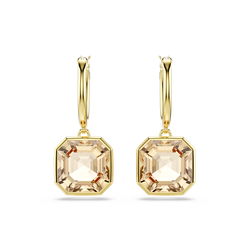 Close-up of Swarovski Millenia drop earrings featuring square-cut caramel crystals and gold-tone finish on a black