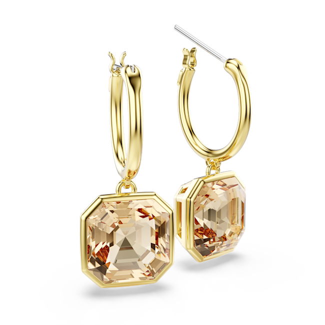 Close-up of Swarovski Millenia drop earrings featuring square-cut caramel crystals and gold-tone hoops. Elegant jewelry