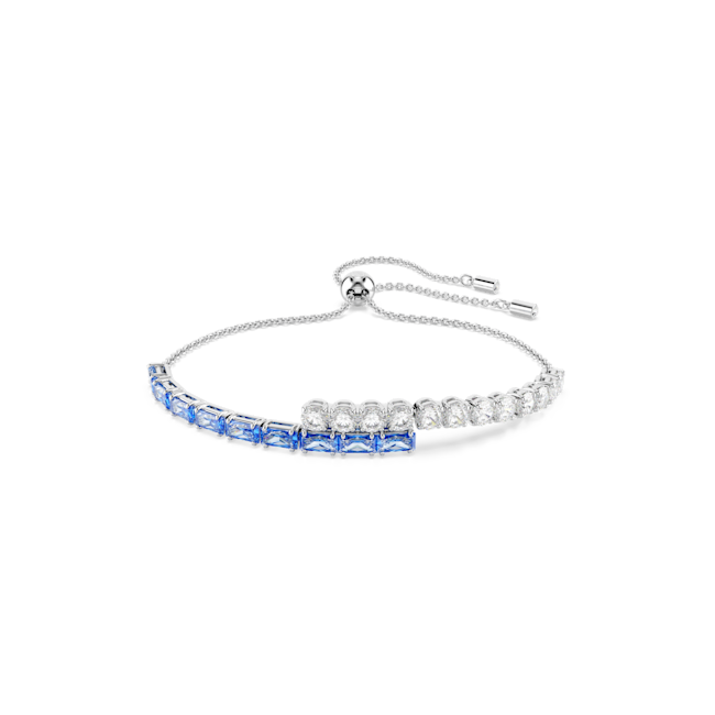 Blue crystal bangle by Swarovski, featuring mixed cuts and rhodium plating. Shows elegant sparkle and design details.
