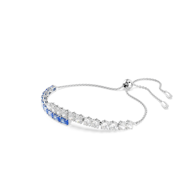 Swarovski Matrix bangle featuring blue & clear crystals set in rhodium plating. Jewelry detail.