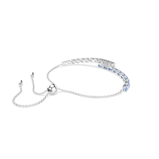 Swarovski Matrix bangle with mixed blue cuts and rhodium plating. Adjustable chain clasp detail.
