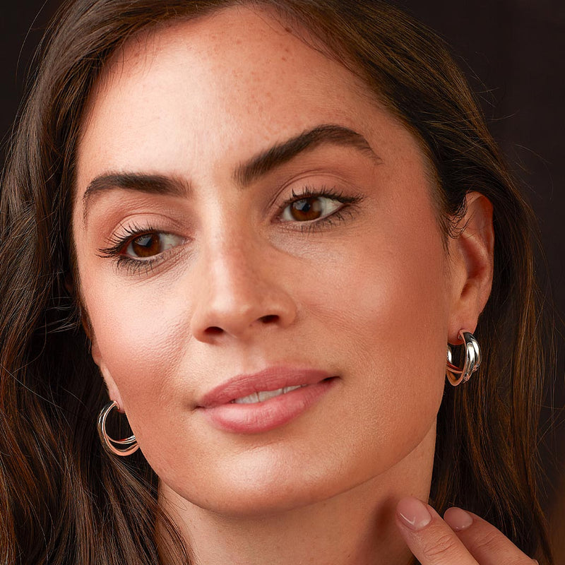 The Serenity Grande cross over semi hoop earrings, a silver metal earrings from Kit Heath, available at OD’s Jewellers in St Helens