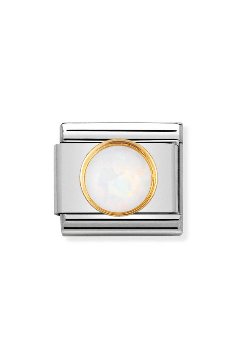 Silver charm with a gold-rimmed opal.

