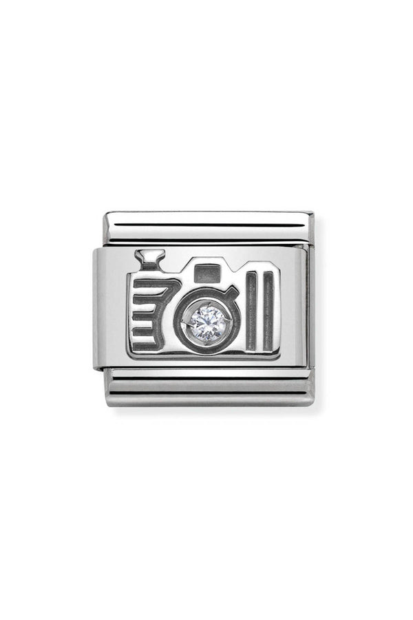 Silver camera charm with a diamond lens.
