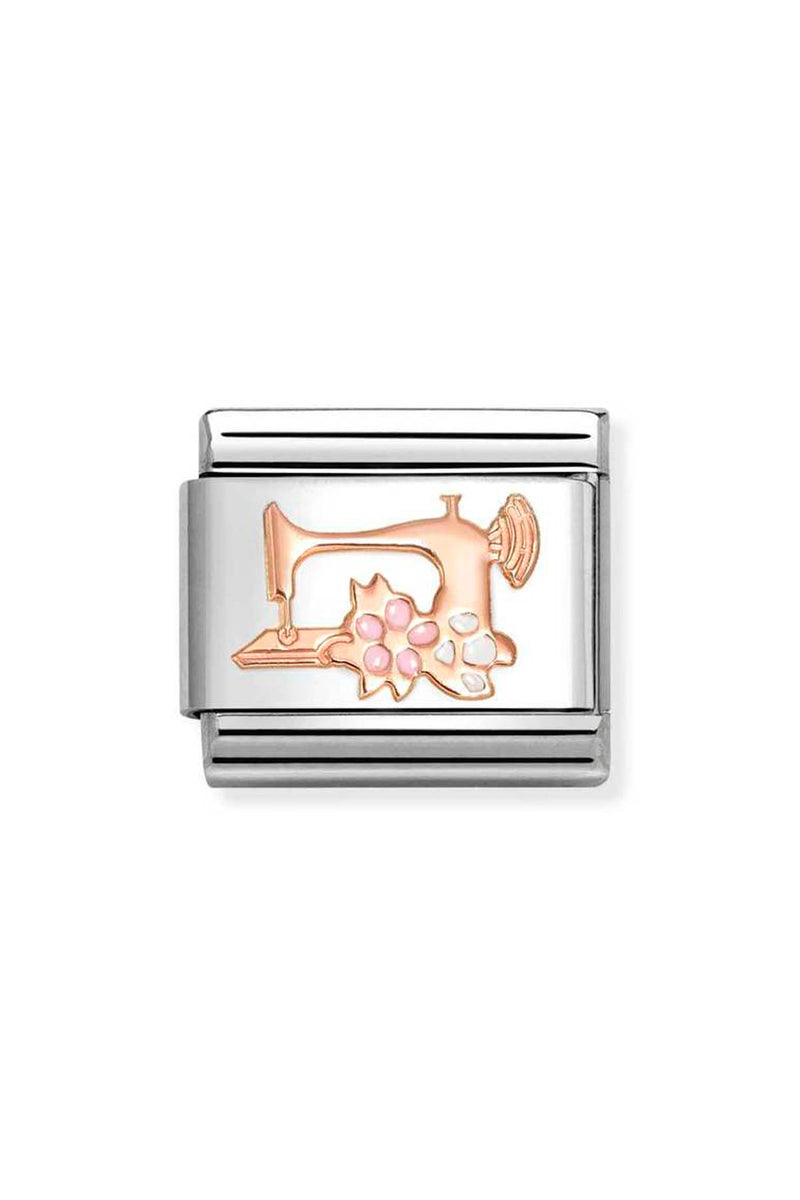 Silver charm with a rose gold sewing machine and pink and white flowers.