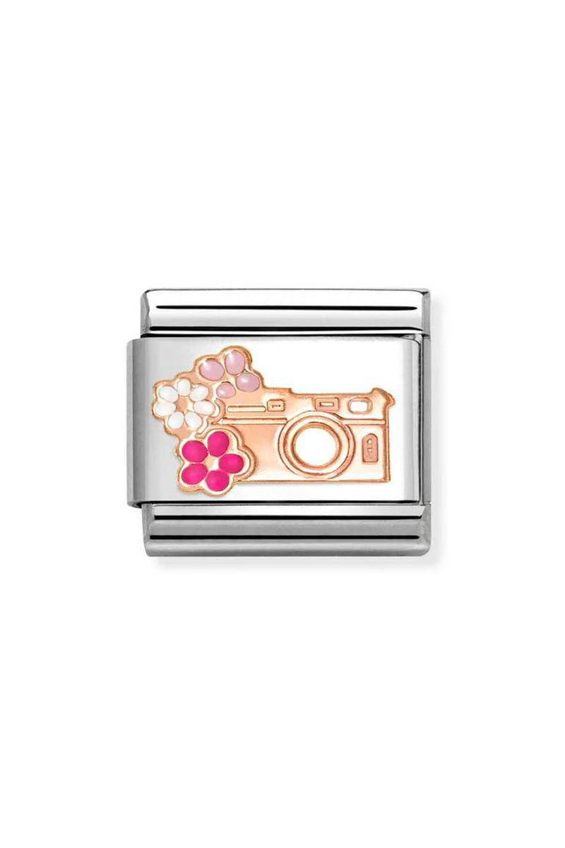 Silver charm with camera and flower design.