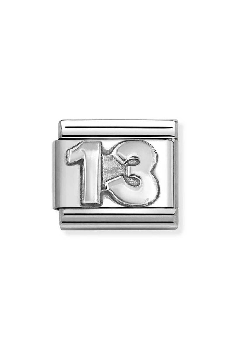 Silver charm with the number 13 on it.