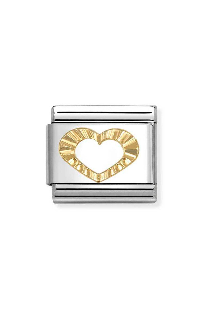 Close-up of a silver and gold charm with a heart.