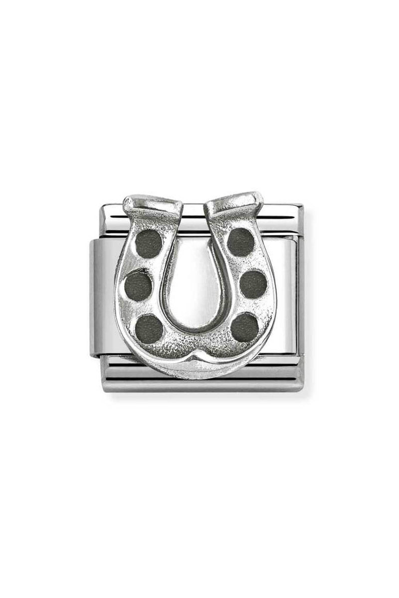 Silver charm with horseshoe design.
