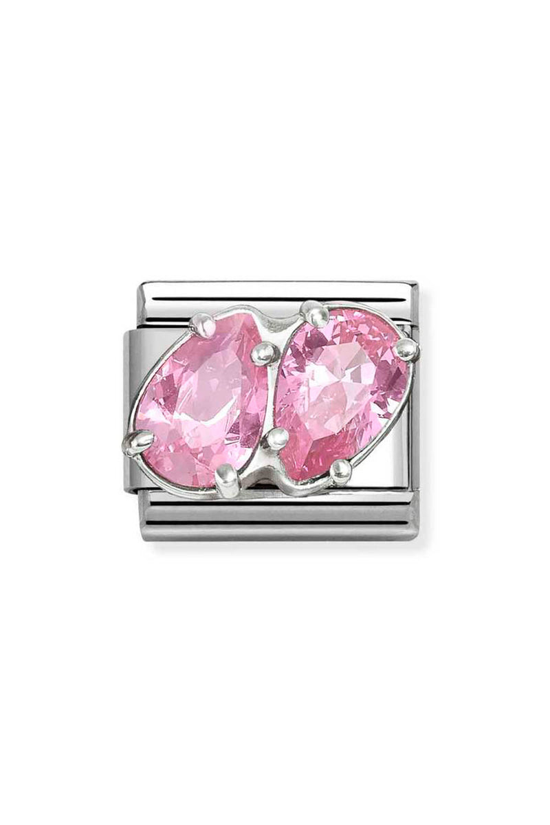 Silver charm with two pink gemstones.
