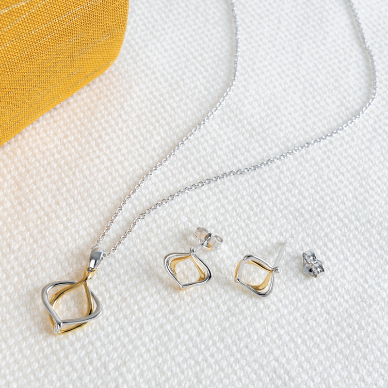 The Alicia Golden Petite Stud Earrings, a silver and gold two tone earrings from Kit Heath, available at OD’s Jewellers in St Helens