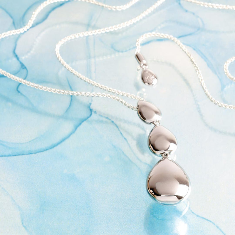 The Kit Heath Coast Pebble Smooth Triple Grande, a silver necklace from Kit Heath, available at OD’s Jewellers in St Helens