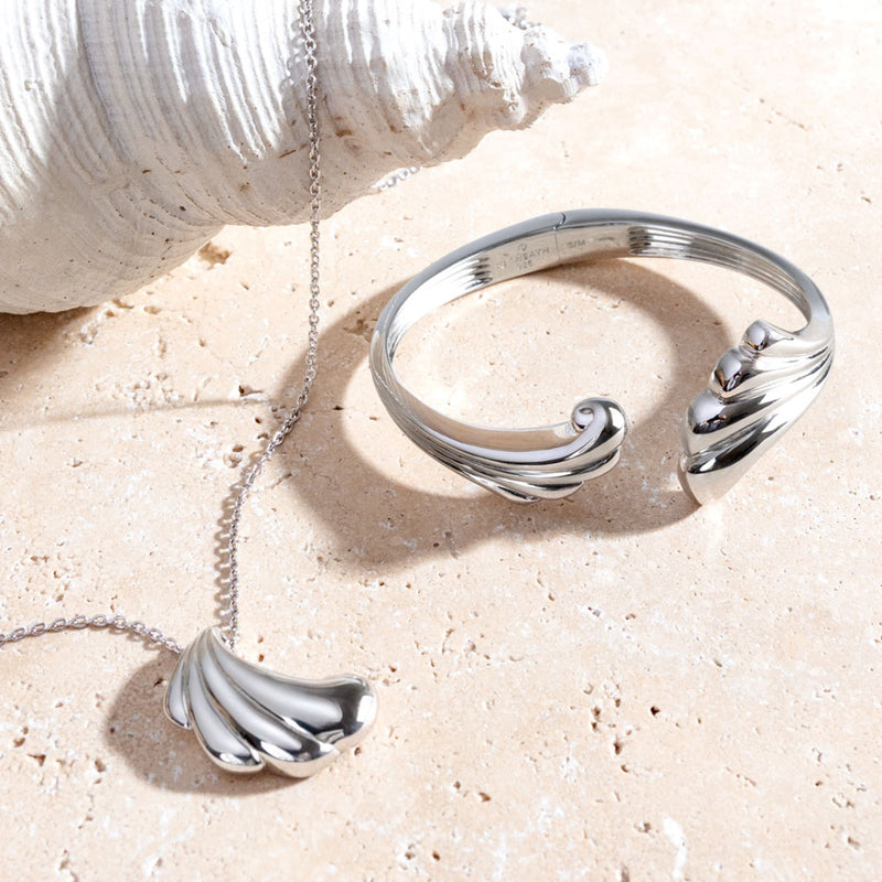 The Kit Heath Océane Shell Echo Grande Necklace, a silver necklace from Kit Heath, available at OD’s Jewellers in St Helens