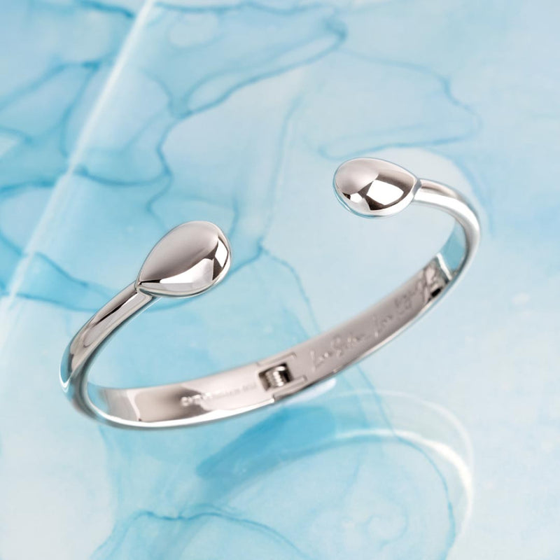 The Kit Heath Coast Pebble Smooth Hinged Bangle, a silver bracelet from Kit Heath, available at OD’s Jewellers in St Helens