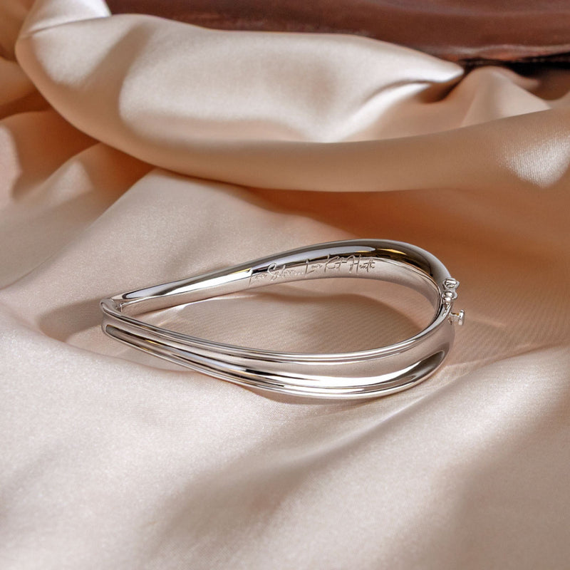 The Kit Heath Serenity Hinged Bangle, a silver bracelet from Kit Heath, available at OD’s Jewellers in St Helens