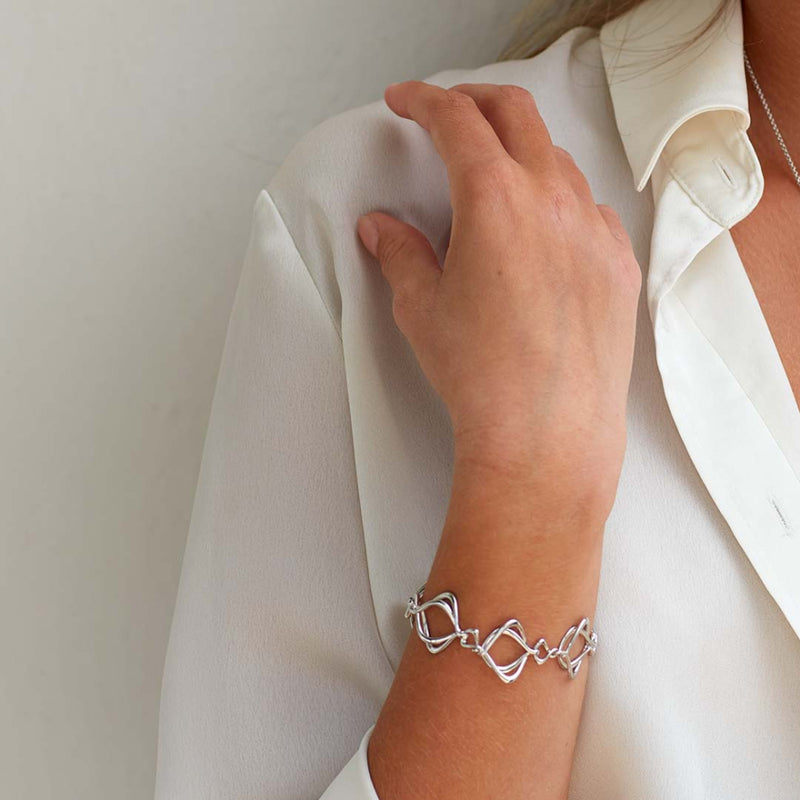 The Kit Heath Alicia Bracelet, a silver metal bracelet from Kit Heath, available at OD’s Jewellers in St Helens.