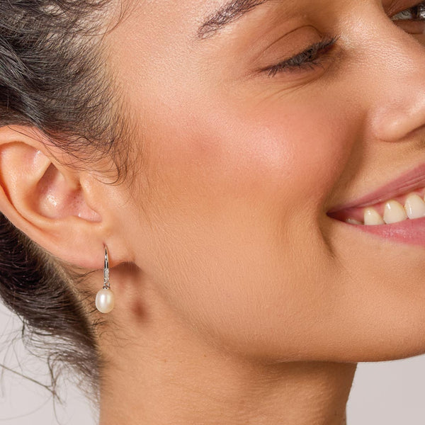 The Kit Heath Revival Pearl Glitz CZ Drop Earring, a white silver earrings from Kit Heath, available at OD’s Jewellers in St Helens