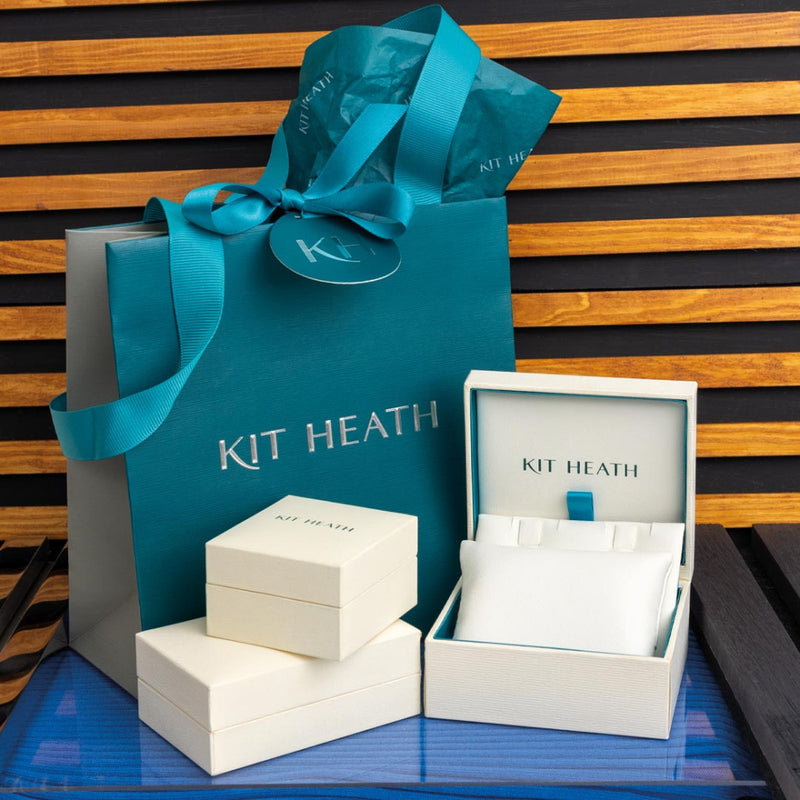 The Kit Heath Bevel Cirque Hinged Huggie Hoop Earrings, a silver earrings from Kit Heath, available at OD’s Jewellers in St Helens