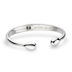 The Kit Heath Coast Pebble Smooth Hinged Bangle, a silver bracelet from Kit Heath, available at OD’s Jewellers in St Helens