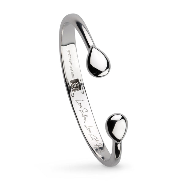The Kit Heath Coast Pebble Smooth Hinged Bangle, a silver bracelet from Kit Heath, available at OD’s Jewellers in St Helens